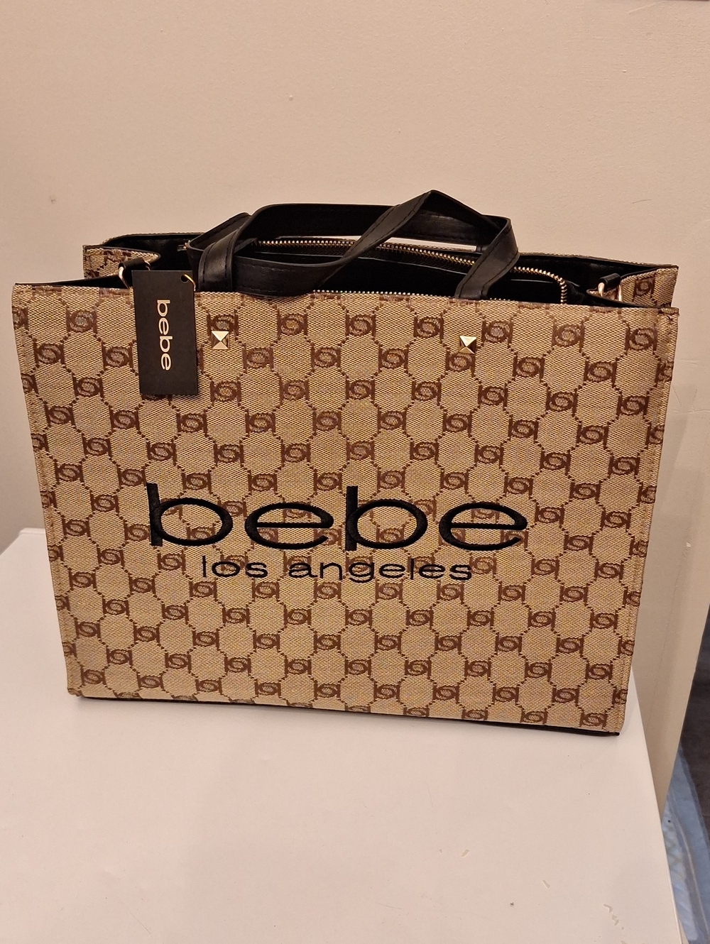 bebe Beige Monogram Tote with Black Accents